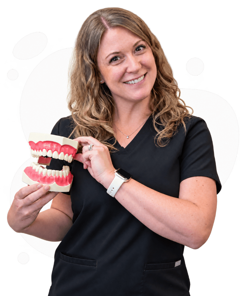 Woman holding a dental example image